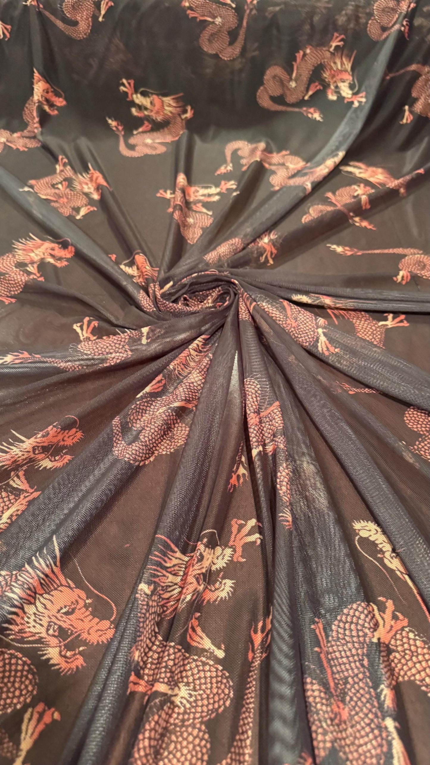 Dragon Exotic design Black/Rust Color  print on power mesh nylon spandex 4-way stretch 58/60” Sold by the YD. Ships worldwide from L.A CA