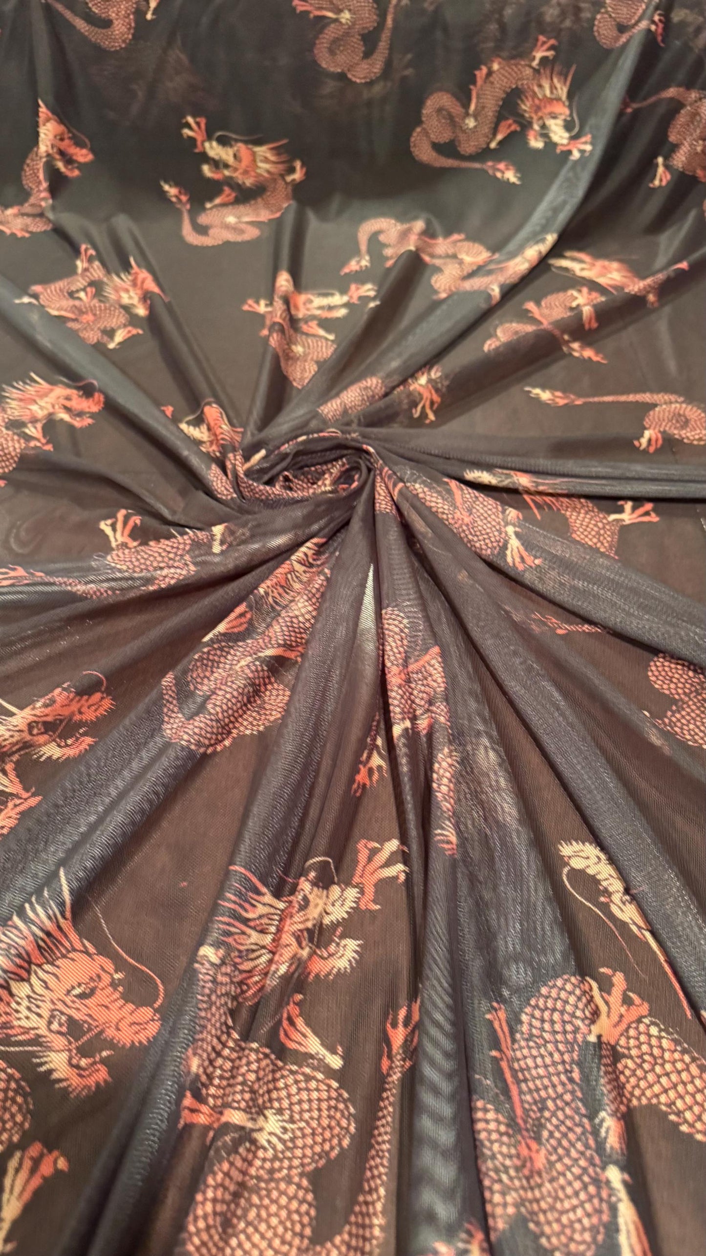 Dragon Exotic design Black/Rust Color  print on power mesh nylon spandex 4-way stretch 58/60” Sold by the YD. Ships worldwide from L.A CA