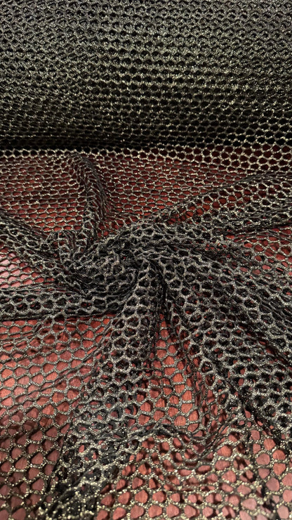 Metallic Spider mesh  Black/Gold 4-way stretch 58/60” Sold by the YD. Ships Worldwide from Los Angeles California USA.