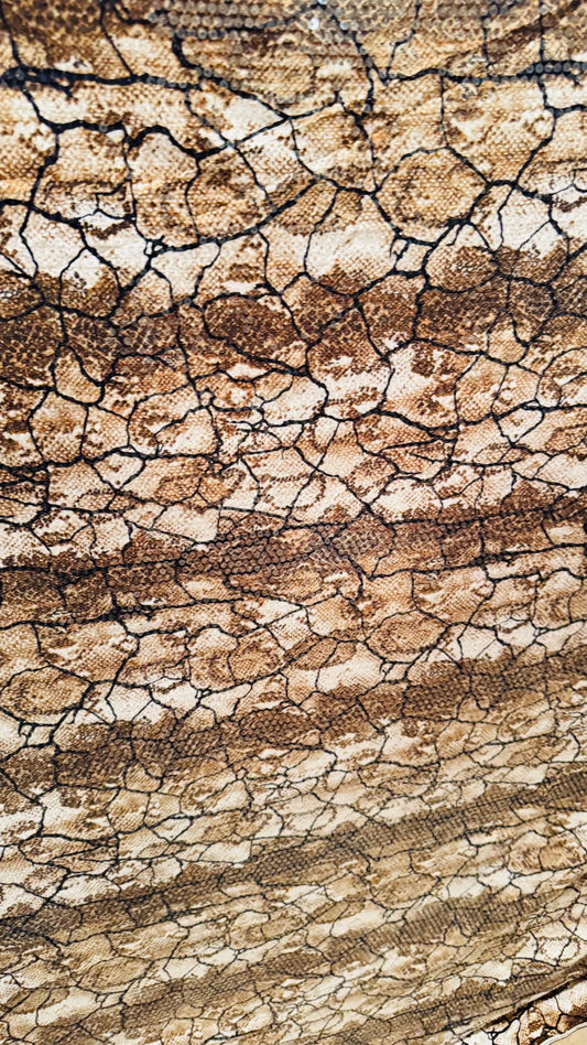Exotic Snake design Brown/Gold  with clear sequins all over spandex base 4-way  58/60" Sold by the YD. Ships worldwide from Los Ángeles CA