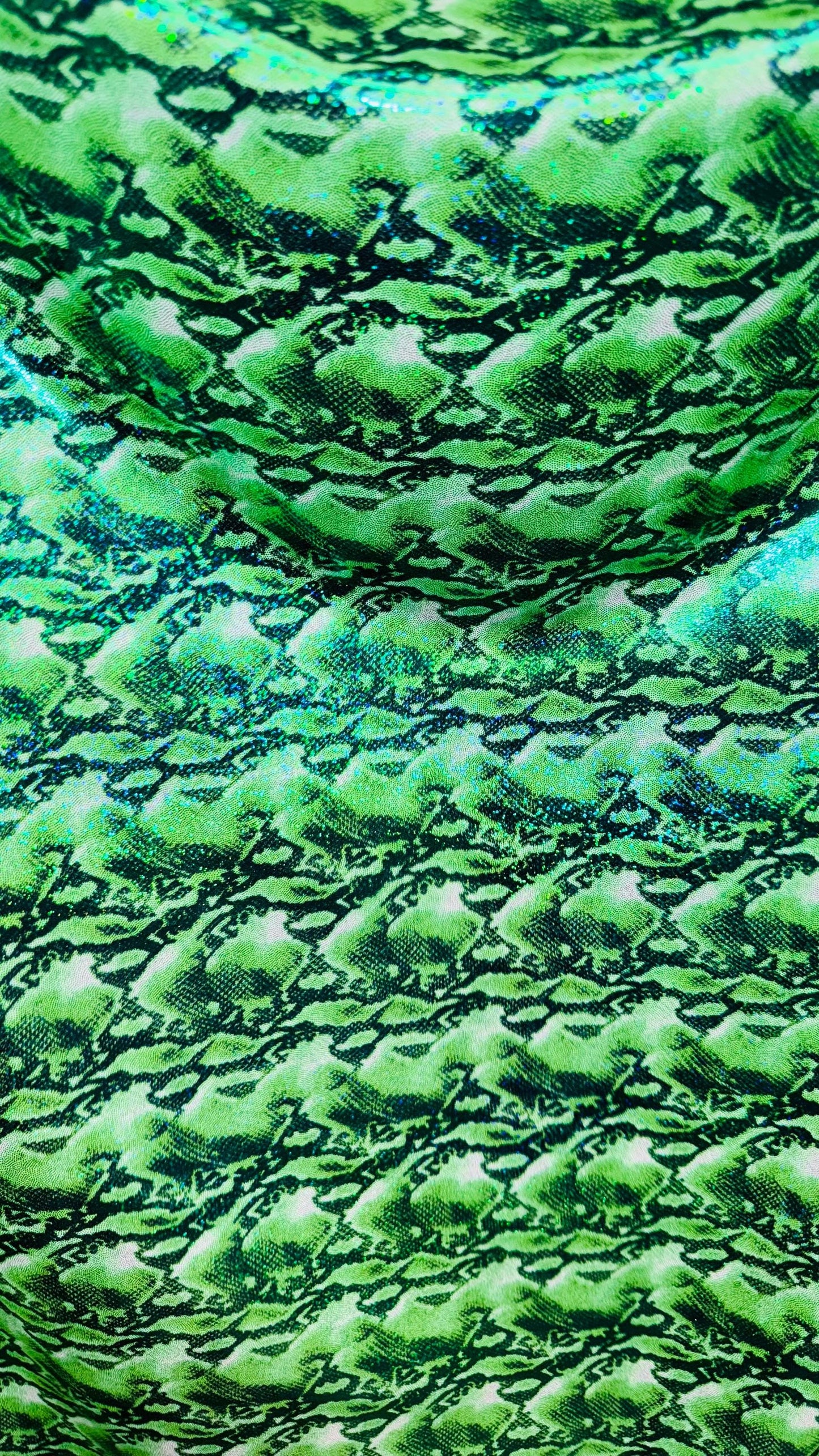 NEW Cobra snake design with hologram ilusión foggy foil all over print on nylon spandex 4way stretch 58/60" Sold by the YD. Ships worldwide