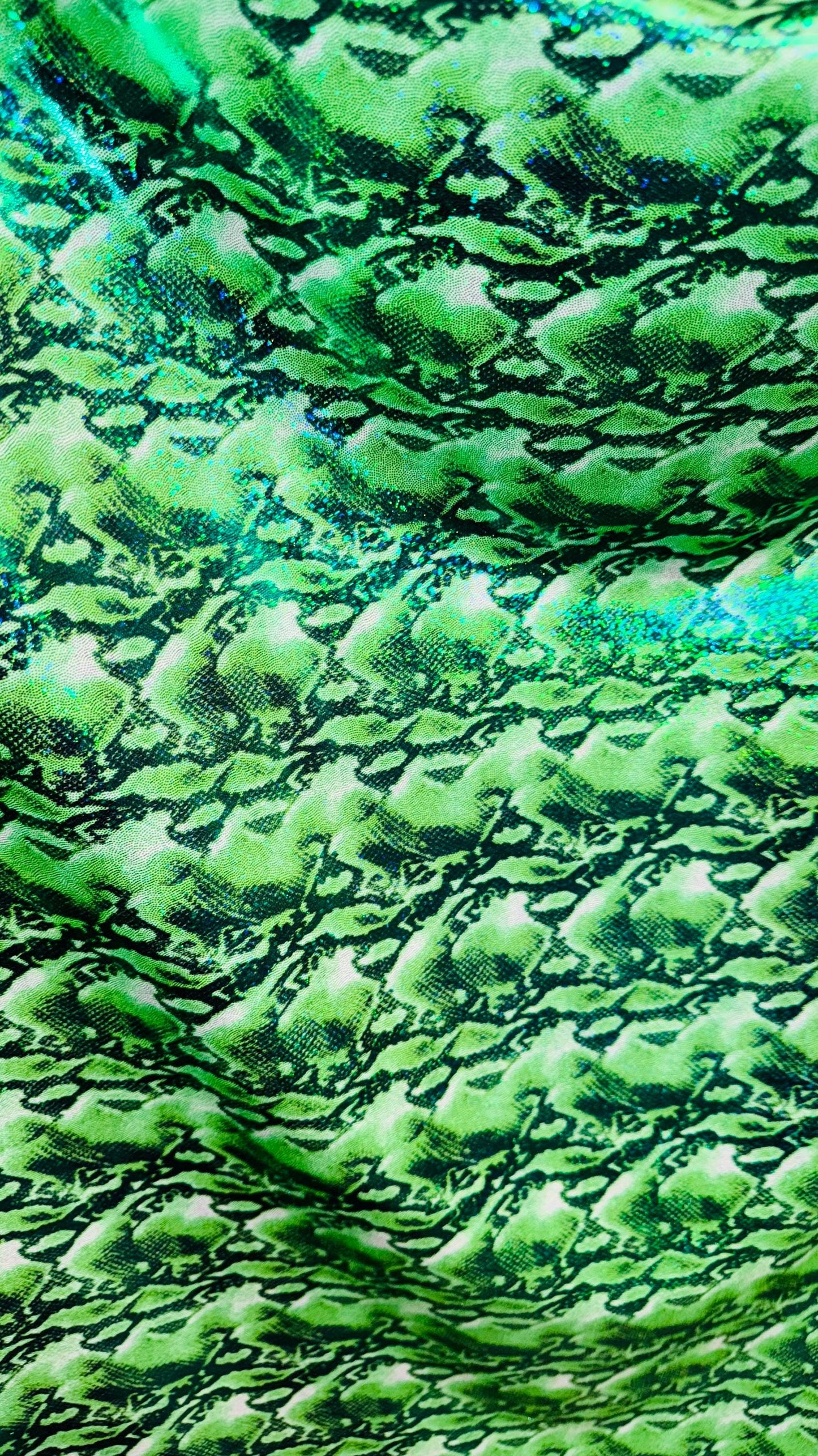NEW Cobra snake design with hologram ilusión foggy foil all over print on nylon spandex 4way stretch 58/60" Sold by the YD. Ships worldwide