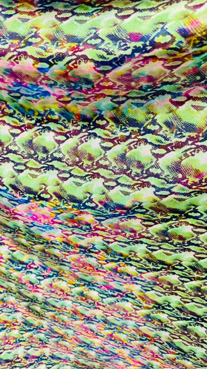 NEW Iridescent Cobra snake design with ilusión foggy foil all over print on metallic nylon spandex 4way stretch 58/60" Sold by the YD.