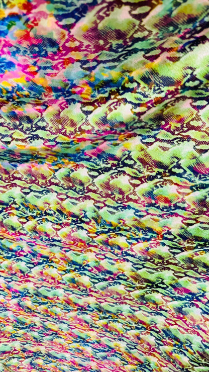 NEW Iridescent Cobra snake design with ilusión foggy foil all over print on metallic nylon spandex 4way stretch 58/60" Sold by the YD.