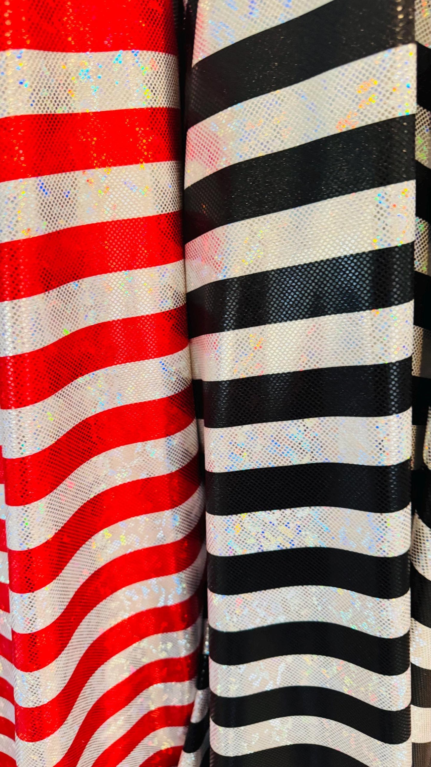 Stripes Freedom design 1” on metallic shattered glass hologram nylon spandex 4-way stretch 58/60” Multicolor Sold by the YD.