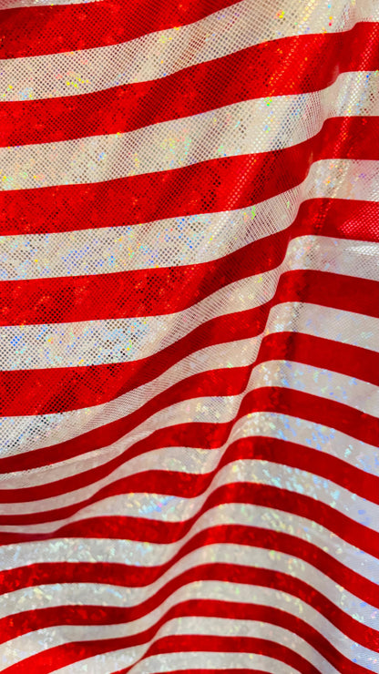 Stripes Freedom design 1” on metallic shattered glass hologram nylon spandex 4-way stretch 58/60” Multicolor Sold by the YD.