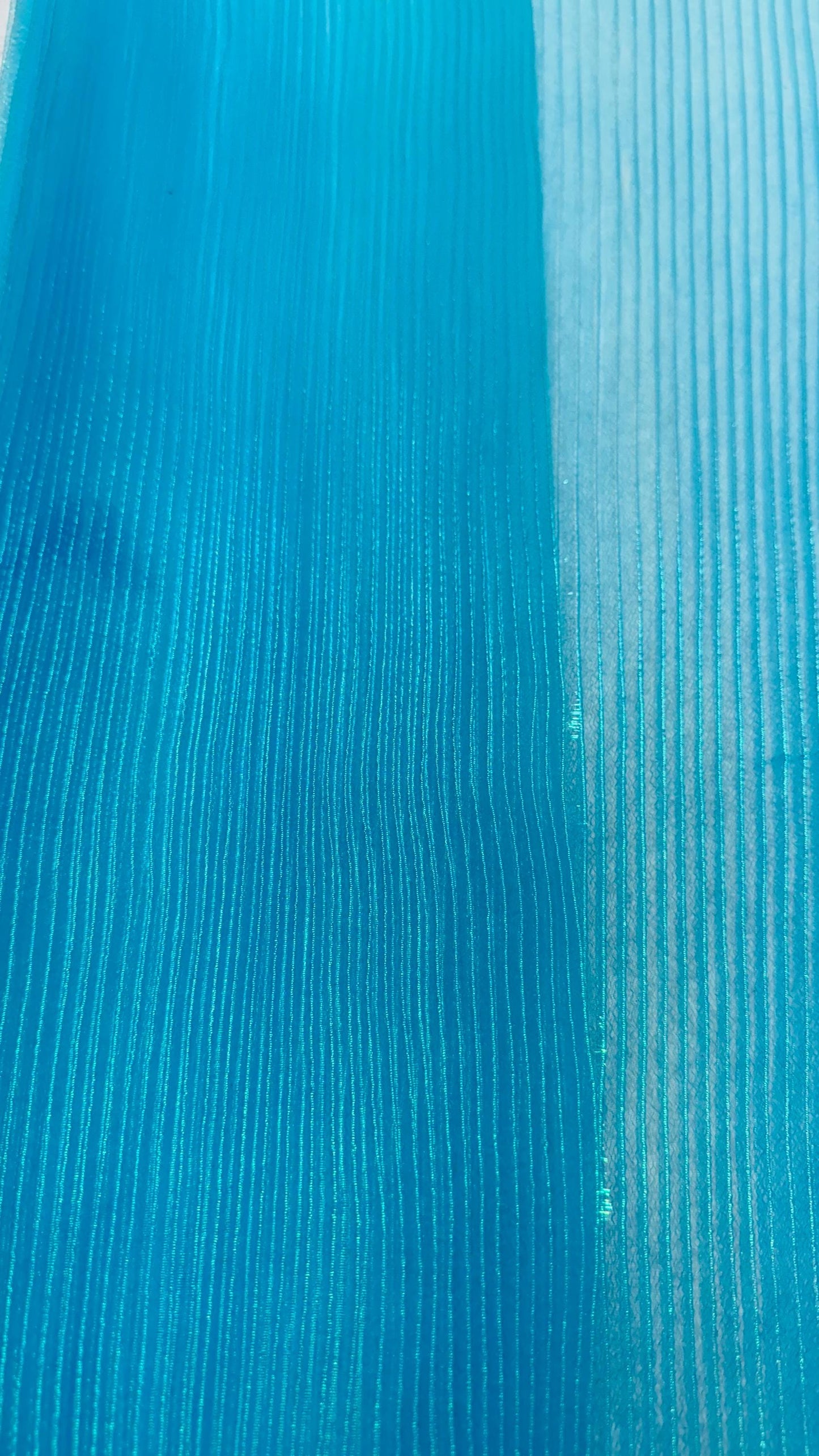 New accordion pleaded Iridescent Organza Aqua Blue  52/54” Sold by the YD. Ships worldwide from Los Angeles California USA.