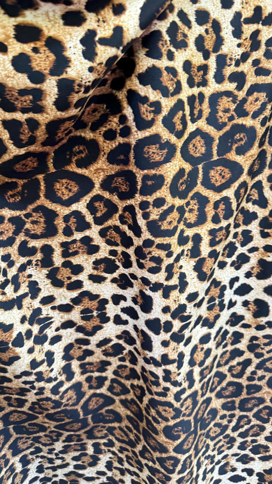 Wild Leopard Desig Brown/Gold on poly spandex techno 4way stretch 58/60" Sold by the YD. Ships worldwide from Los Ángeles California USA