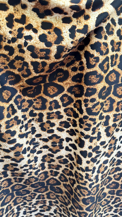 Wild Leopard Desig Brown/Gold on poly spandex techno 4way stretch 58/60" Sold by the YD. Ships worldwide from Los Ángeles California USA