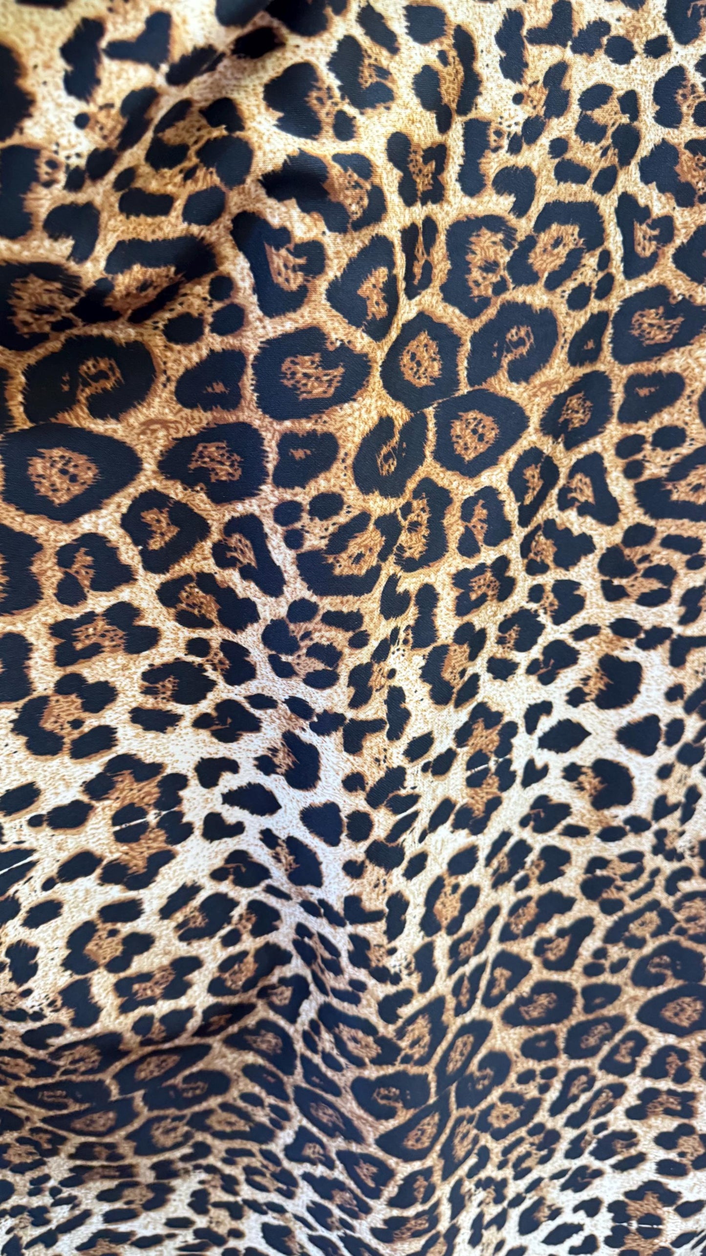 Wild Leopard Desig Brown/Gold on poly spandex techno 4way stretch 58/60" Sold by the YD. Ships worldwide from Los Ángeles California USA