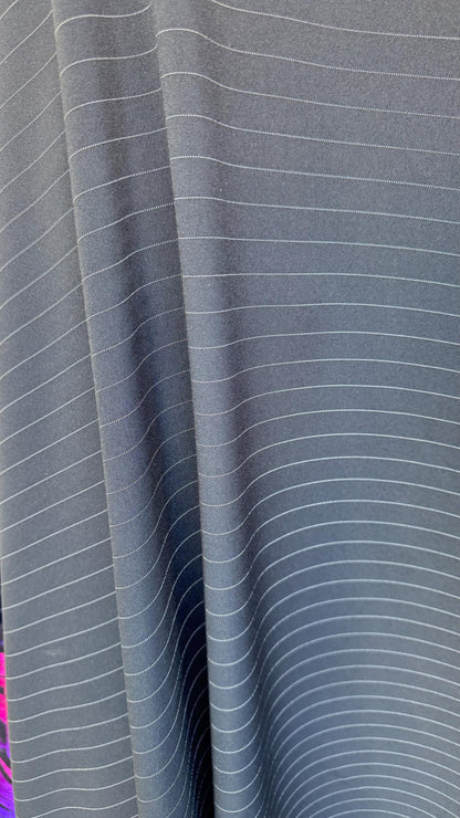 Pin stripes on poly spandex 2-way stretch 58/60” Sold by the YD. Ships worldwide from Los Angeles California USA. High quality fabrics