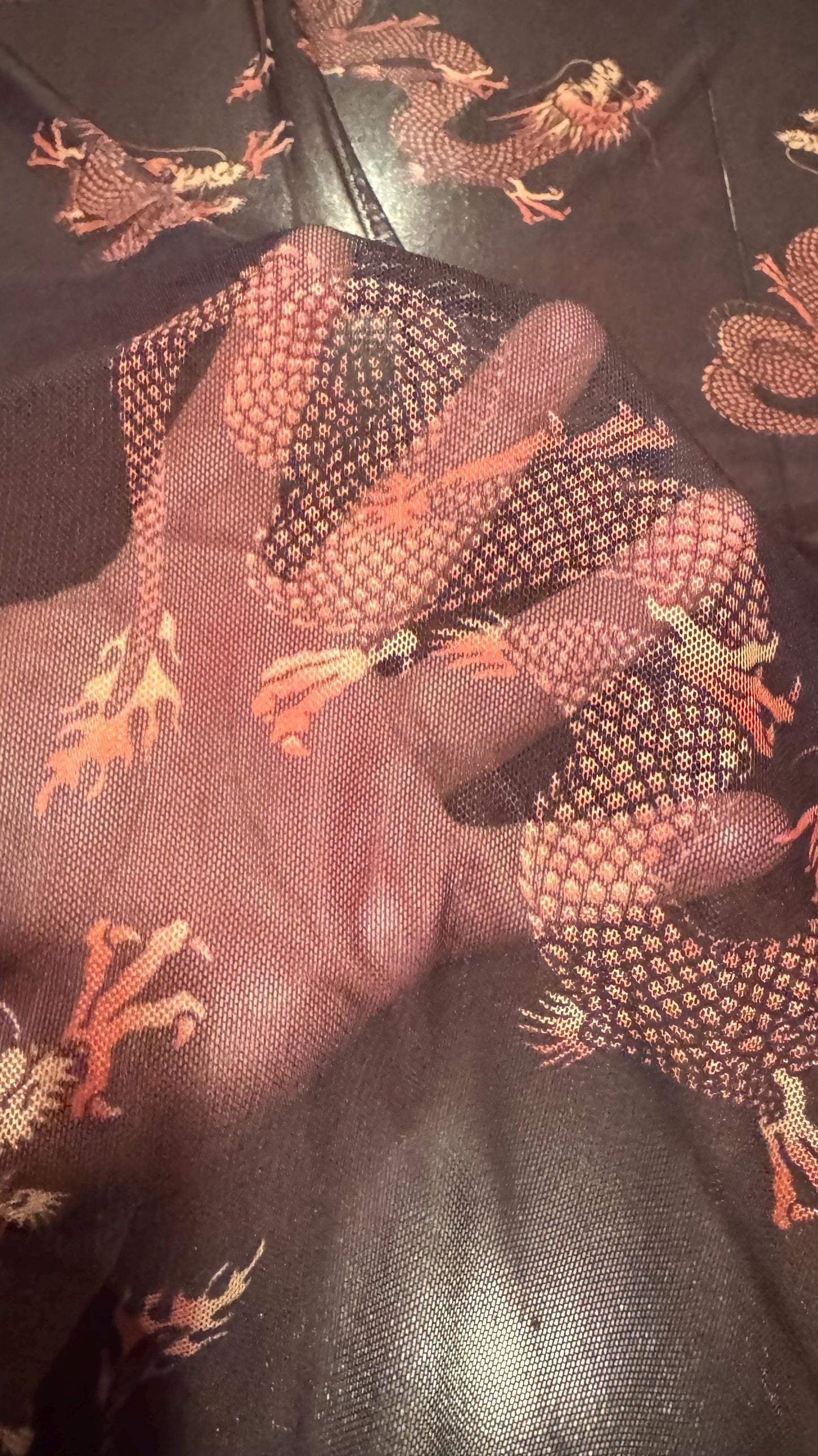 Dragon Exotic design Black/Rust Color  print on power mesh nylon spandex 4-way stretch 58/60” Sold by the YD. Ships worldwide from L.A CA