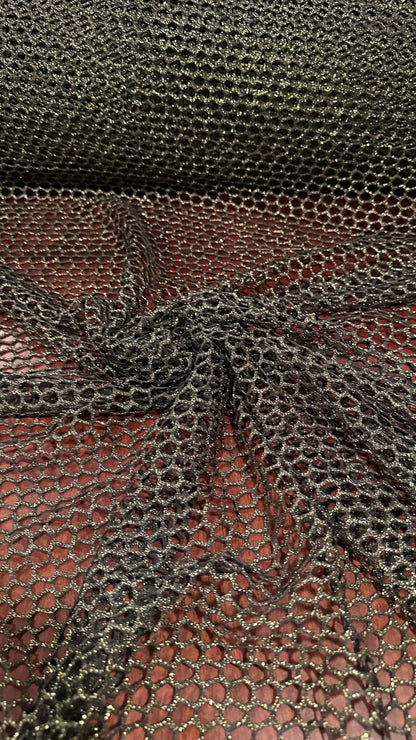 Metallic Spider mesh  Black/Gold 4-way stretch 58/60” Sold by the YD. Ships Worldwide from Los Angeles California USA.