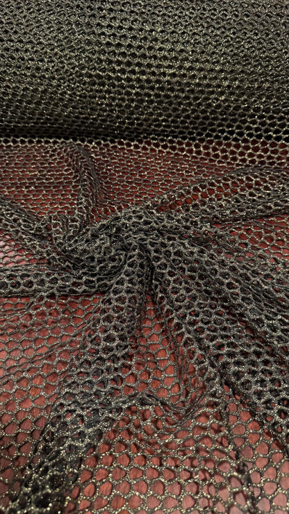 Metallic Spider mesh  Black/Gold 4-way stretch 58/60” Sold by the YD. Ships Worldwide from Los Angeles California USA.