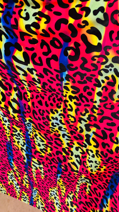New Leopard design with vivid rainbow colors  on heavy stretch velvet 4way stretch 58/60" Sold by the YD. Ships worldwide from Los Ángeles