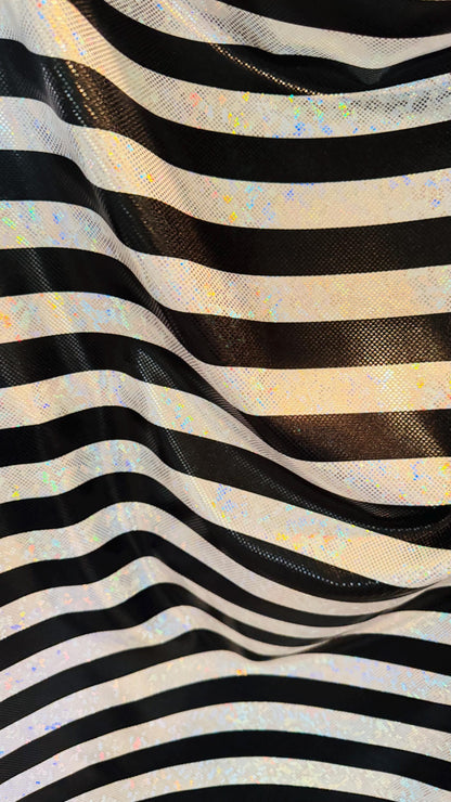Stripes Freedom design 1” on metallic shattered glass hologram nylon spandex 4-way stretch 58/60” Multicolor Sold by the YD.