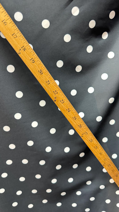 New spandex polka dots Design Black/white 4 way stretch poly spandex 58/60” Sold by the YD. Ships worldwide from Los Angeles California USA.