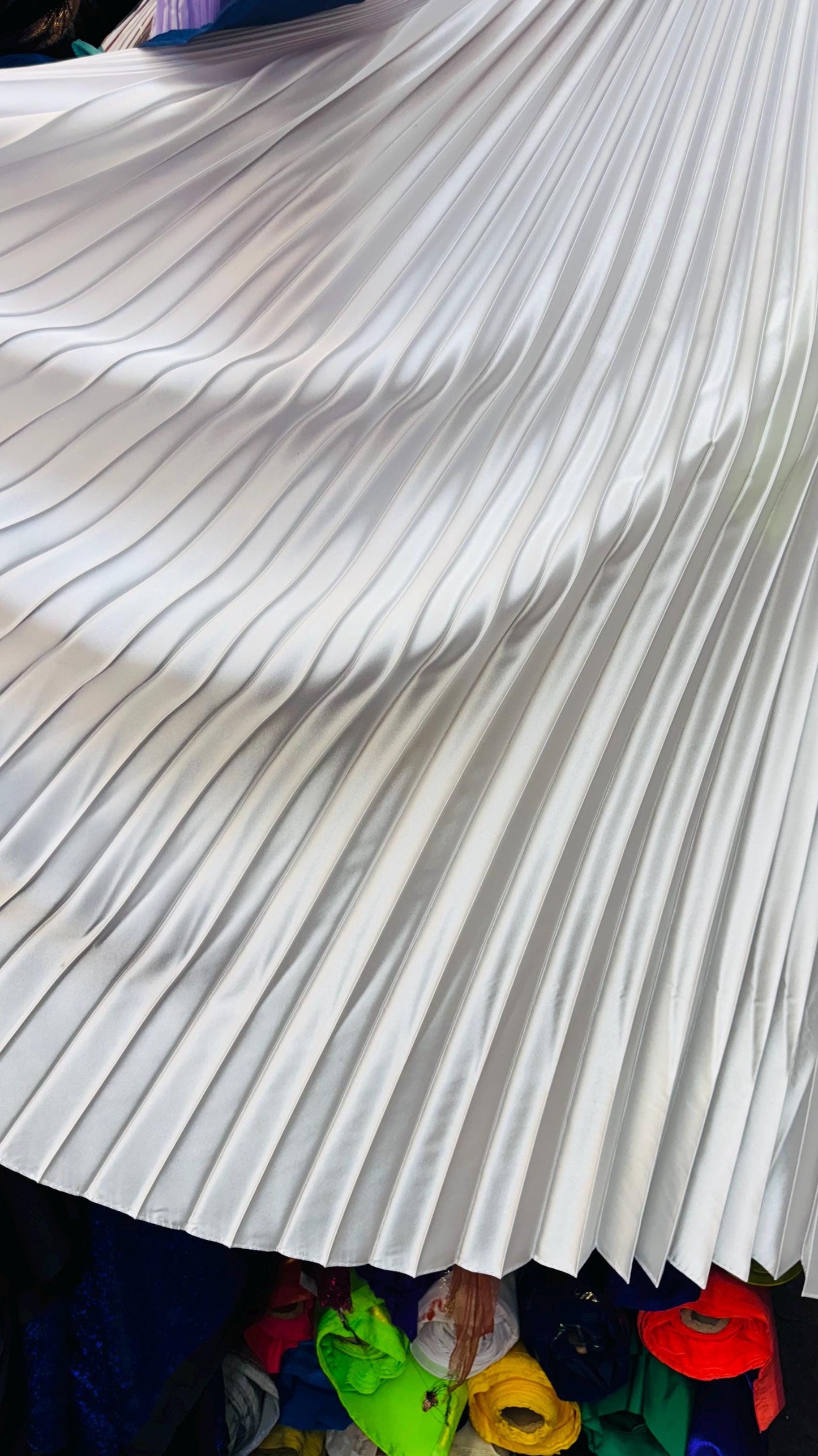 Sunburst pleated Super Shiny Satin non stretch 126” length by 58” width Sold by the PC. Ships worldwide from Los Angeles California USA
