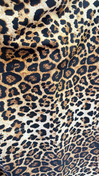 Wild Leopard Desig Brown/Gold on poly spandex techno 4way stretch 58/60" Sold by the YD. Ships worldwide from Los Ángeles California USA