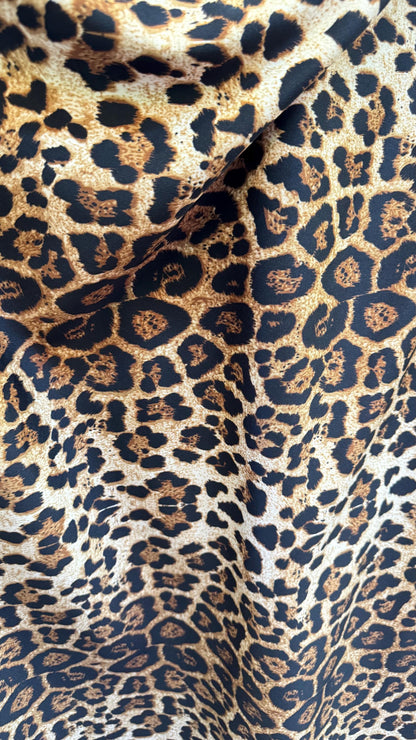 Wild Leopard Desig Brown/Gold on poly spandex techno 4way stretch 58/60" Sold by the YD. Ships worldwide from Los Ángeles California USA