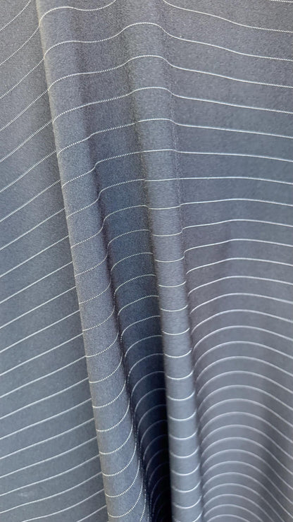 Pin stripes on poly spandex 2-way stretch 58/60” Sold by the YD. Ships worldwide from Los Angeles California USA. High quality fabrics
