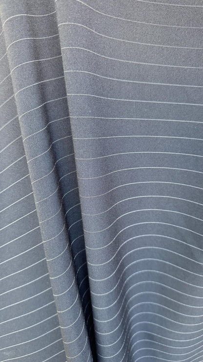Pin stripes on poly spandex 2-way stretch 58/60” Sold by the YD. Ships worldwide from Los Angeles California USA. High quality fabrics