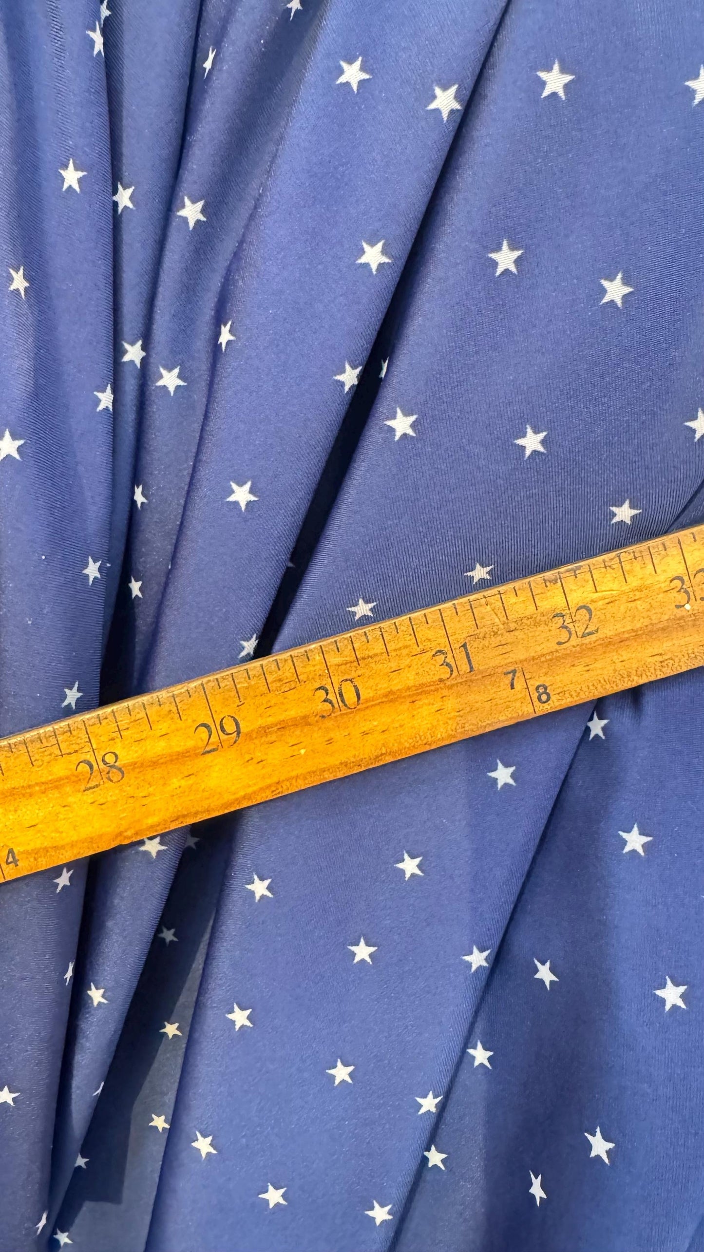 Small Stars Freedom design blue/white on nylon spandex 4way stretch 58/60" Sold by the yd. Ships worldwide from Los Angeles California USA