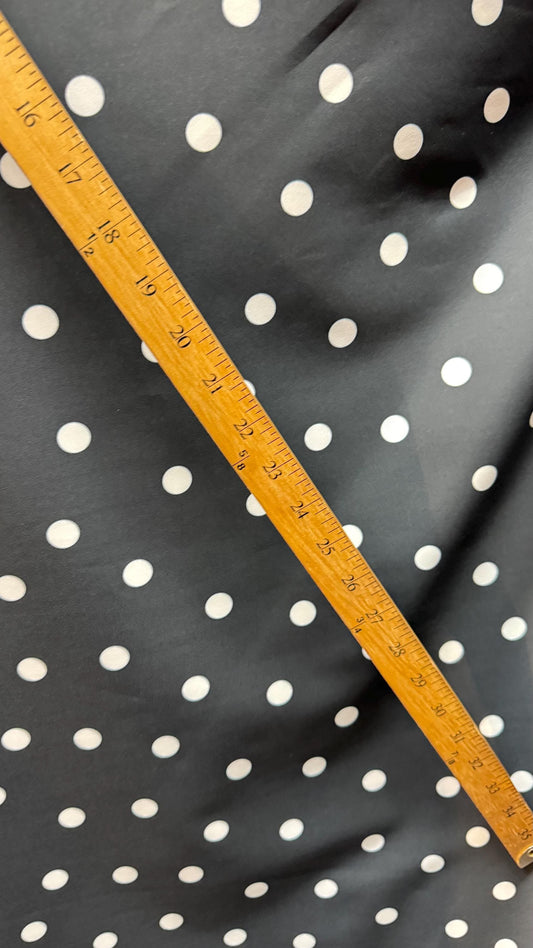New spandex polka dots Design Black/white 4 way stretch poly spandex 58/60” Sold by the YD. Ships worldwide from Los Angeles California USA.