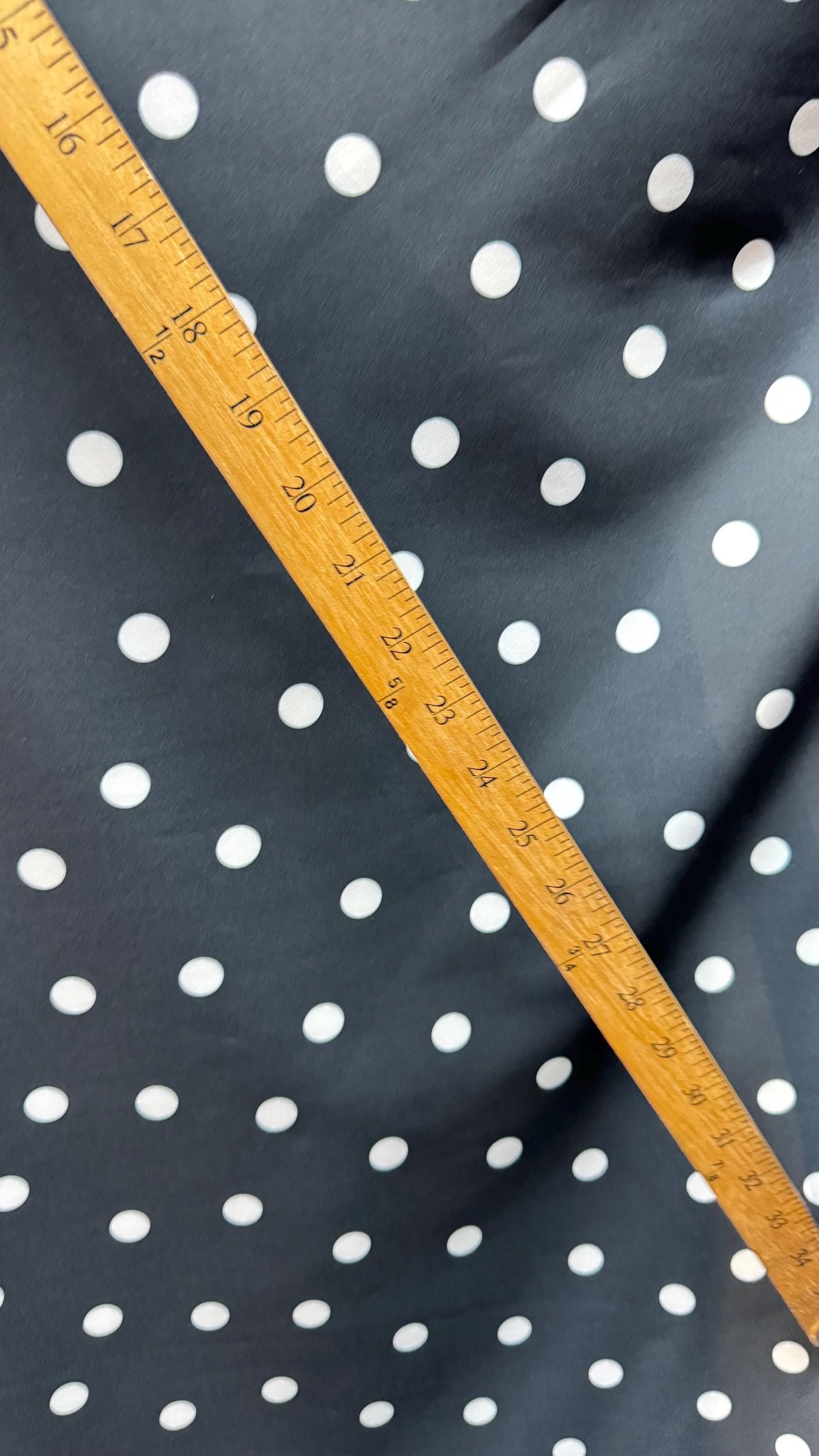 New spandex polka dots Design Black/white 4 way stretch poly spandex 58/60” Sold by the YD. Ships worldwide from Los Angeles California USA.