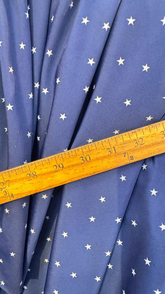 Small Stars Freedom design blue/white on nylon spandex 4way stretch 58/60" Sold by the yd. Ships worldwide from Los Angeles California USA