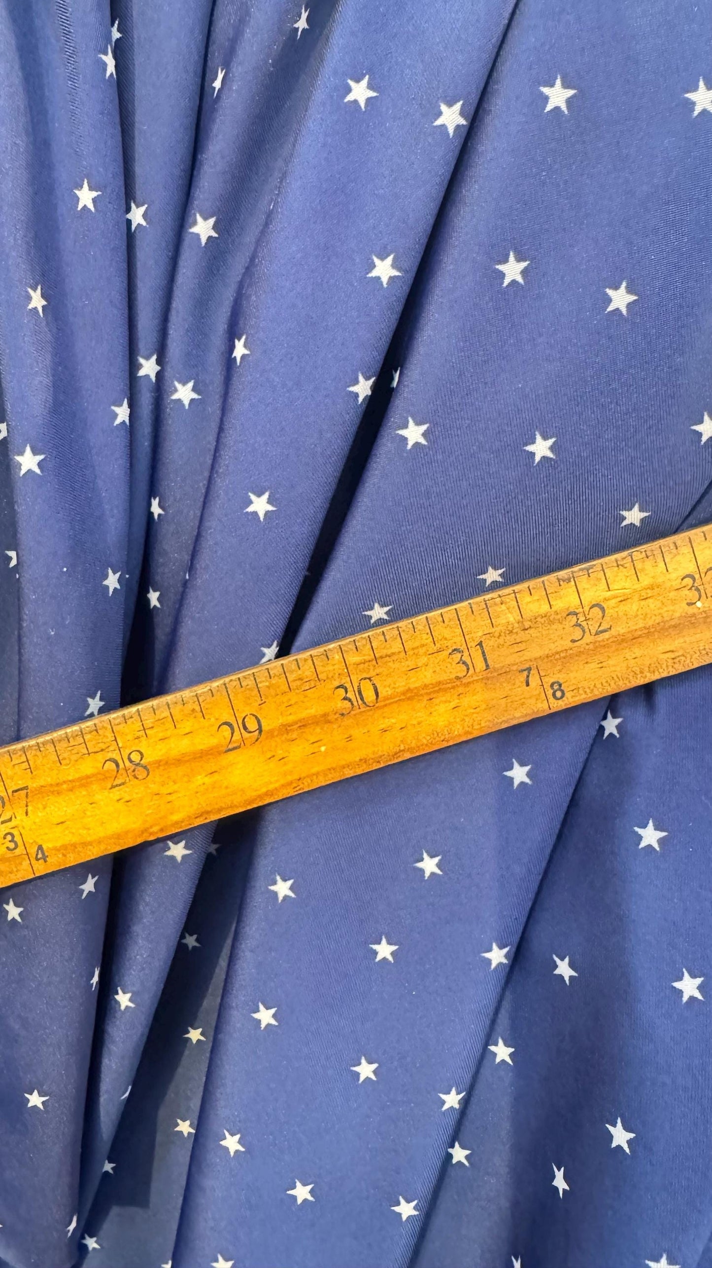 Small Stars Freedom design blue/white on nylon spandex 4way stretch 58/60" Sold by the yd. Ships worldwide from Los Angeles California USA