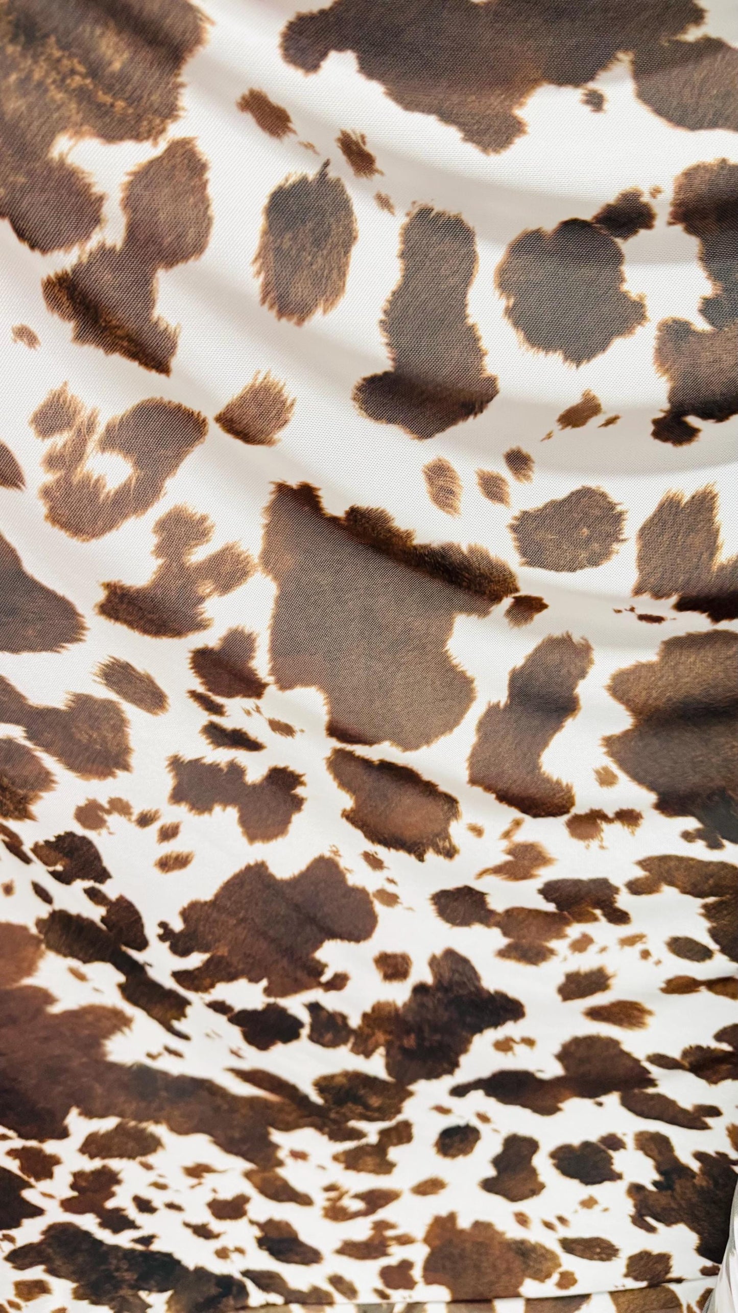 Cow design white/brown print on great quality of nylon mesh 4-way stretch 58/60” Sold by the YD. Ships Worldwide from Los Angeles California