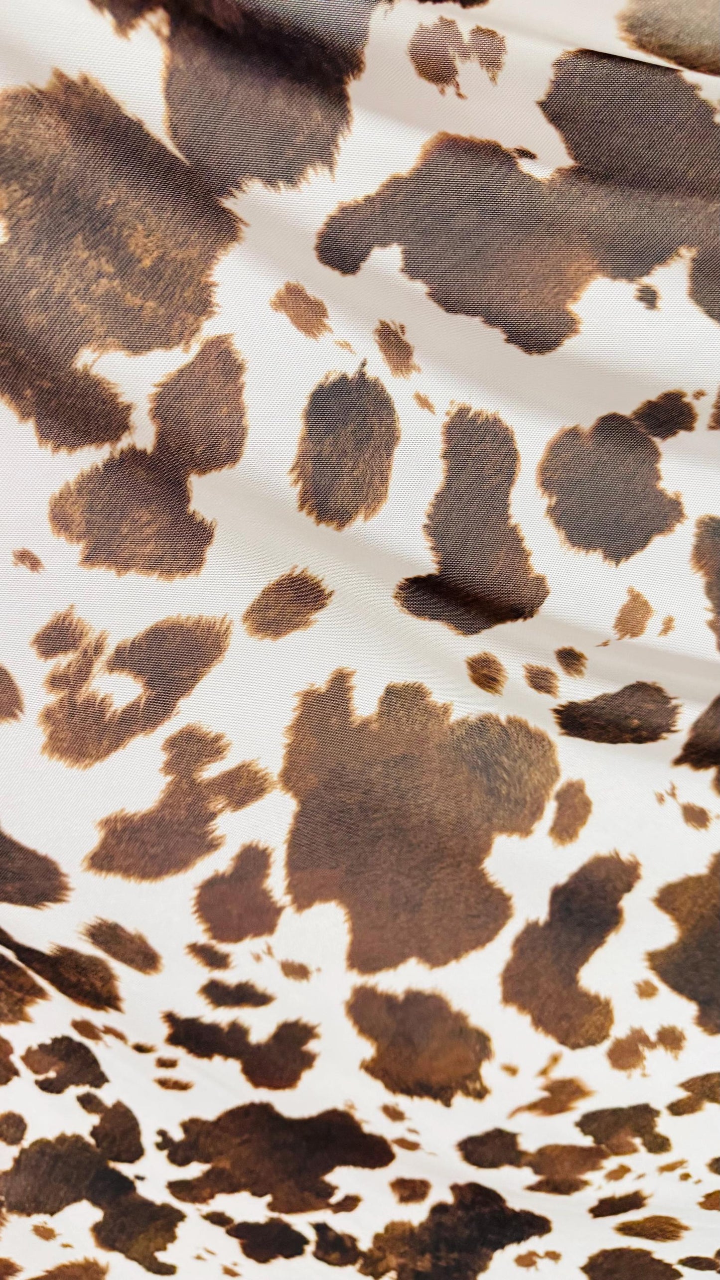 Cow design white/brown print on great quality of nylon mesh 4-way stretch 58/60” Sold by the YD. Ships Worldwide from Los Angeles California