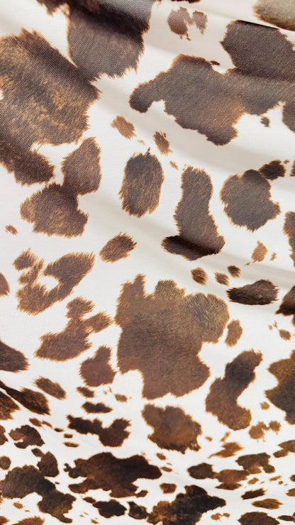 Cow design white/brown print on great quality of nylon mesh 4-way stretch 58/60” Sold by the YD. Ships Worldwide from Los Angeles California