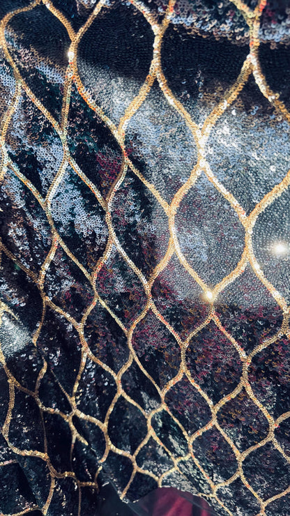 Abstract design cosmic glitz sequins Black/Gold on stretch mesh 2-way 52/54” Sold by the yd Ships worldwide from Los Angeles California USA
