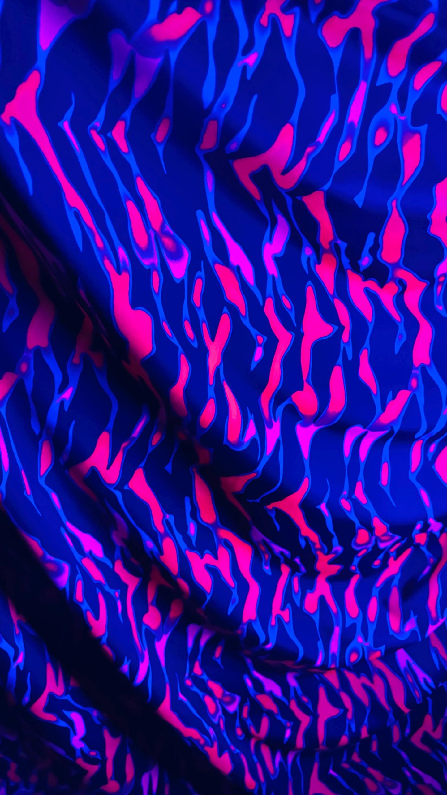 New UV light reflective Tiger abstract design Neon Ponk/Black  print on  heavy nylon spandex 4-way stretch 58/60” Sold by the YD.