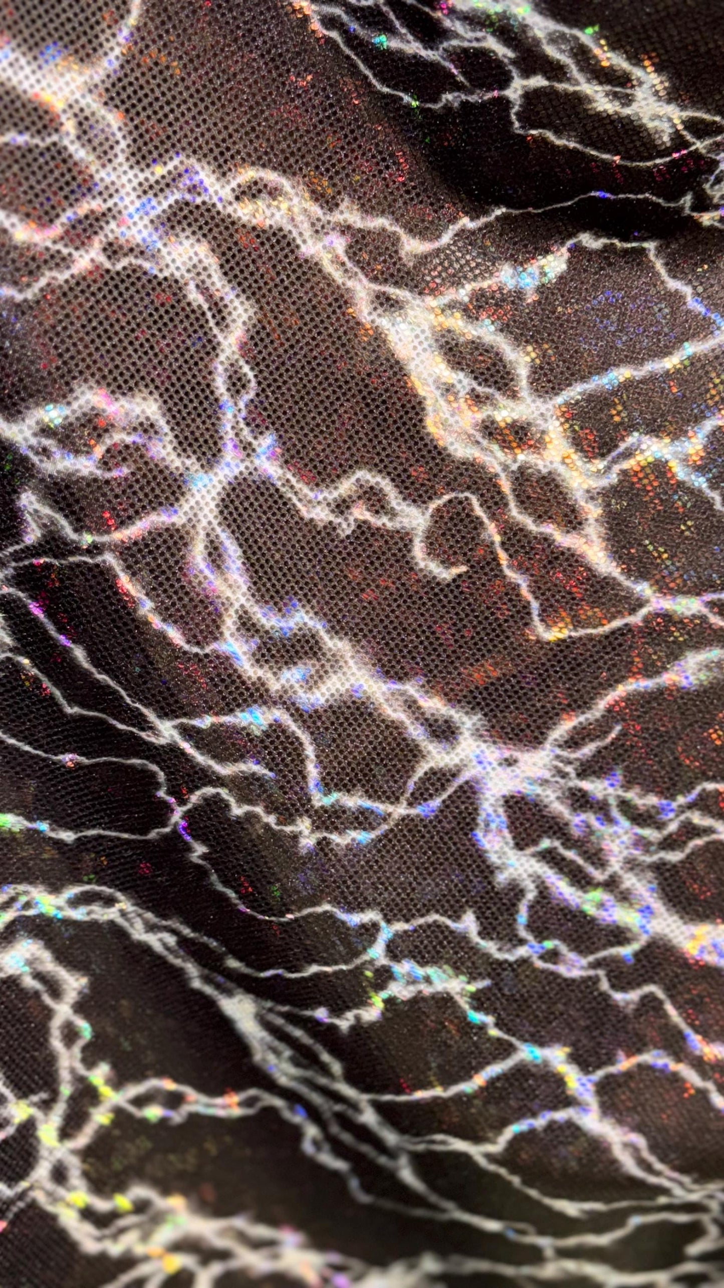 Thunderbolt design on Shattered Glass Hologram Metallic nylon spandex 4way Stretch 58/60" Sold by the YD Ships worldwide from Los Angeles CA
