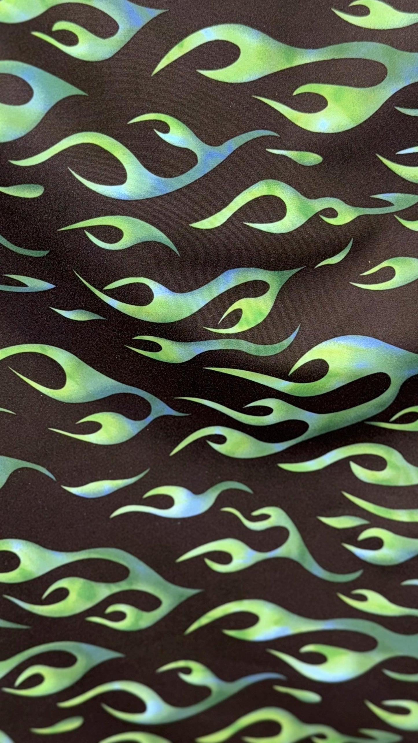 Hot flame design black/Green  print on heavy nylon spandex 4way stretch 58/60" Sold by the YD. Ships worldwide from Los Angeles California