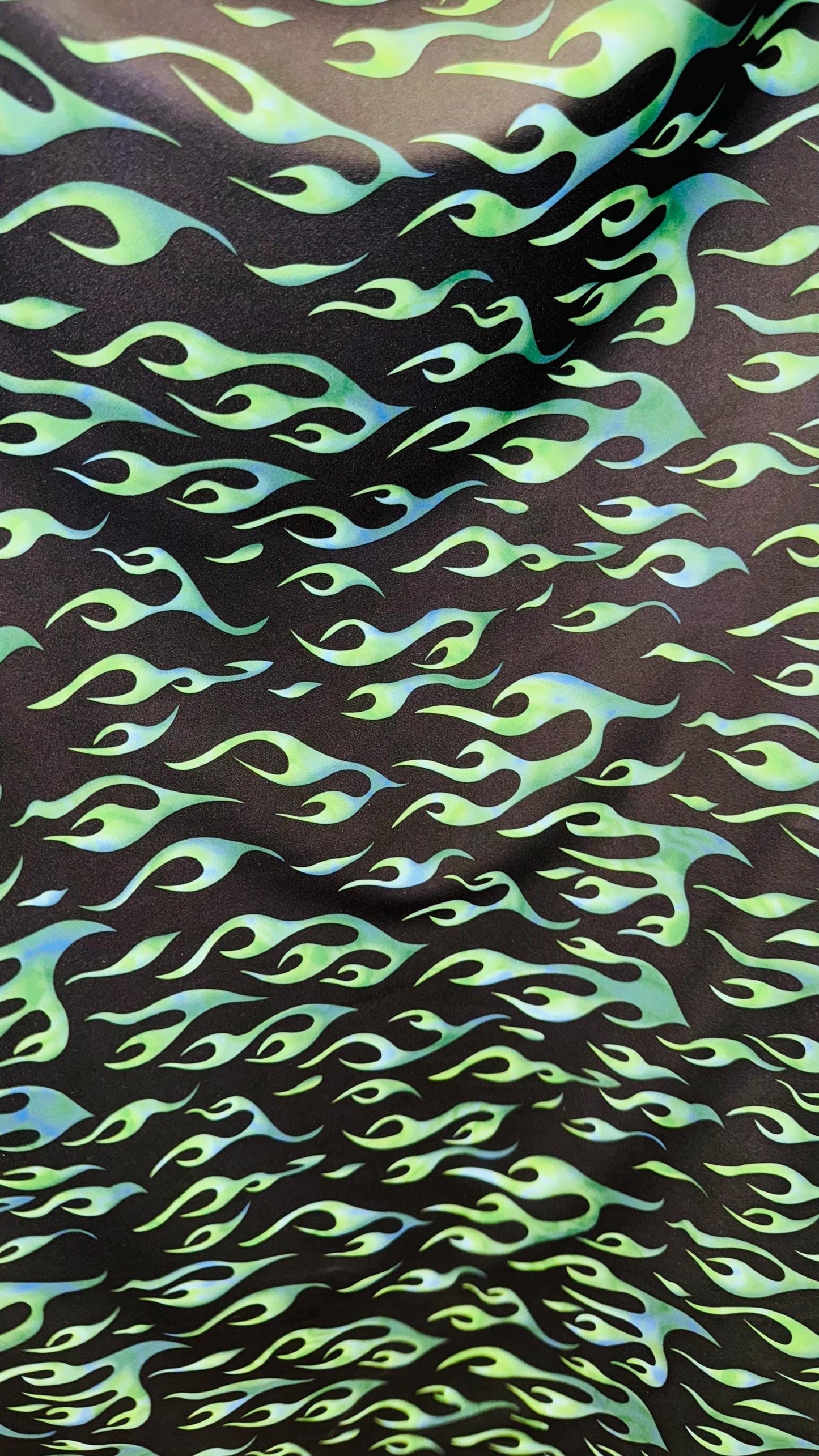 Hot flame design black/Green  print on heavy nylon spandex 4way stretch 58/60" Sold by the YD. Ships worldwide from Los Angeles California