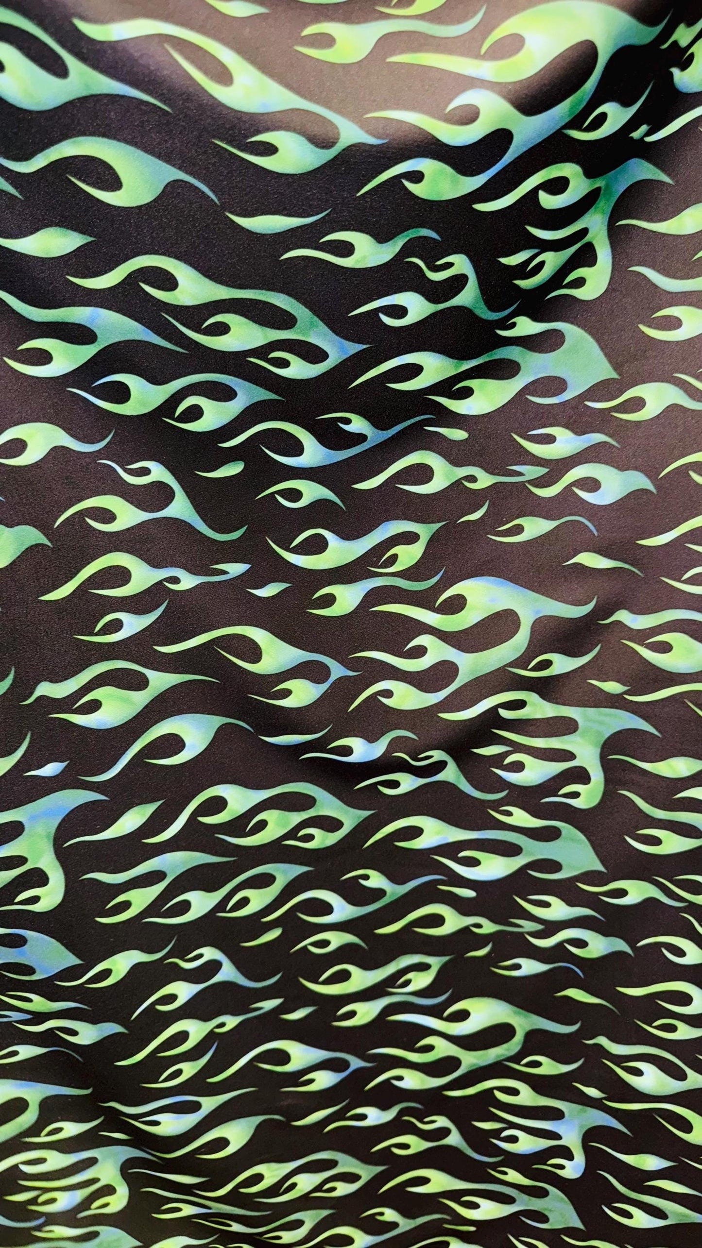 Hot flame design black/Green  print on heavy nylon spandex 4way stretch 58/60" Sold by the YD. Ships worldwide from Los Angeles California