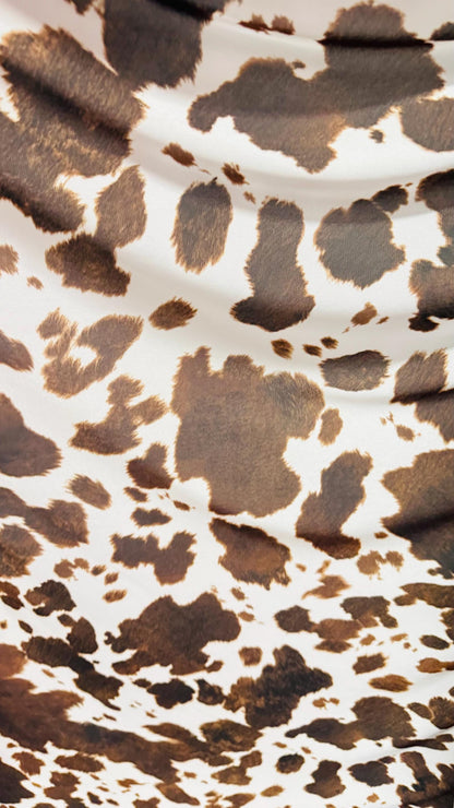 Cow design white/brown print on great quality of nylon mesh 4-way stretch 58/60” Sold by the YD. Ships Worldwide from Los Angeles California