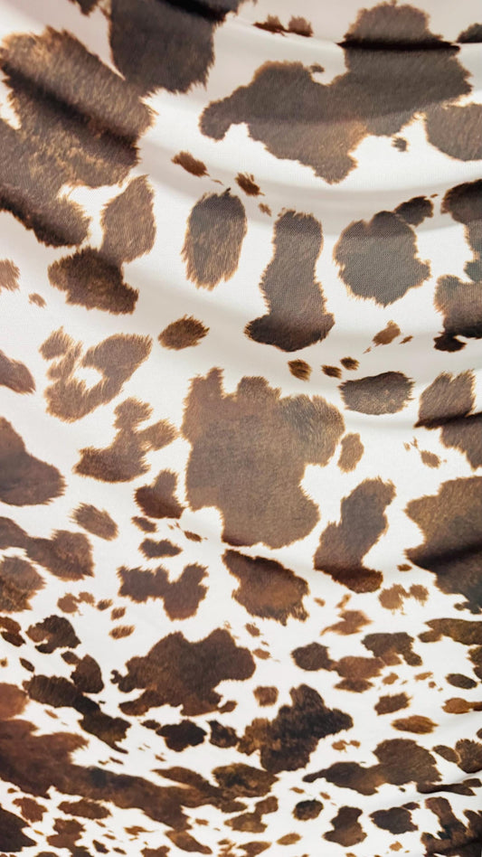 Cow design white/brown print on great quality of nylon mesh 4-way stretch 58/60” Sold by the YD. Ships Worldwide from Los Angeles California