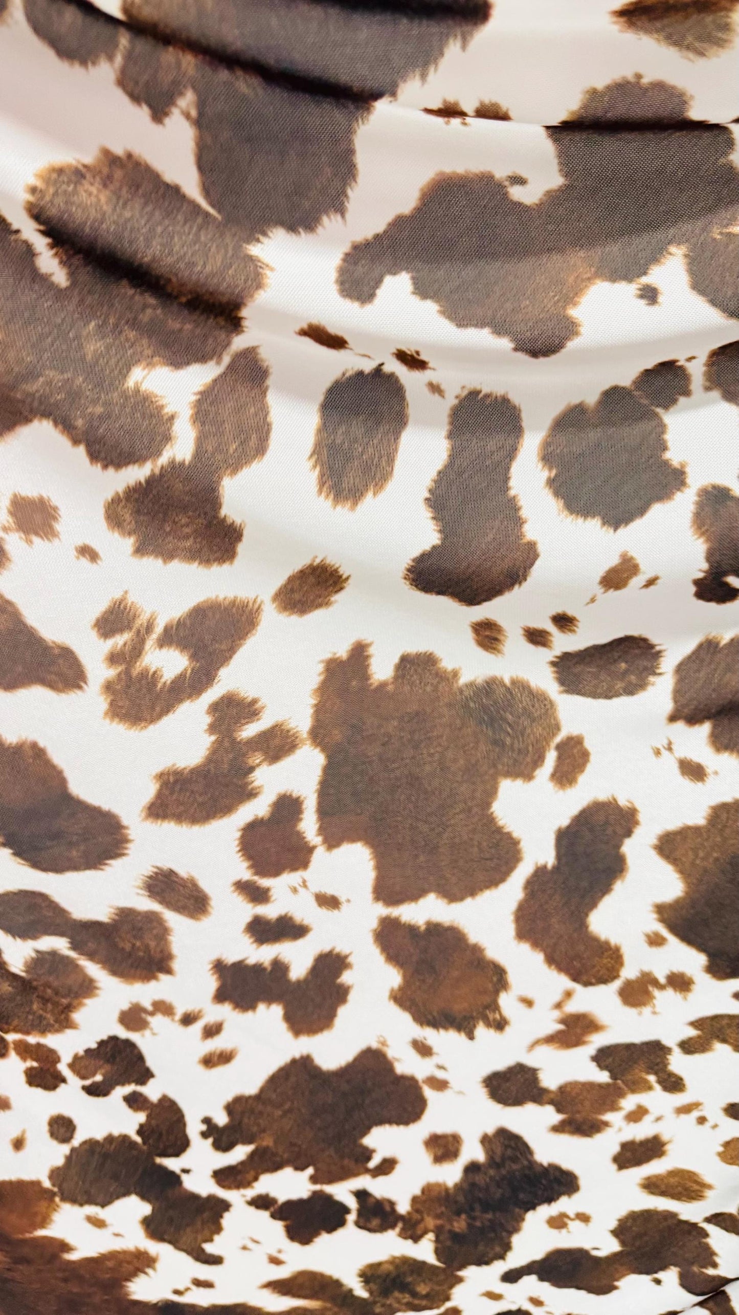 Cow design white/brown print on great quality of nylon mesh 4-way stretch 58/60” Sold by the YD. Ships Worldwide from Los Angeles California
