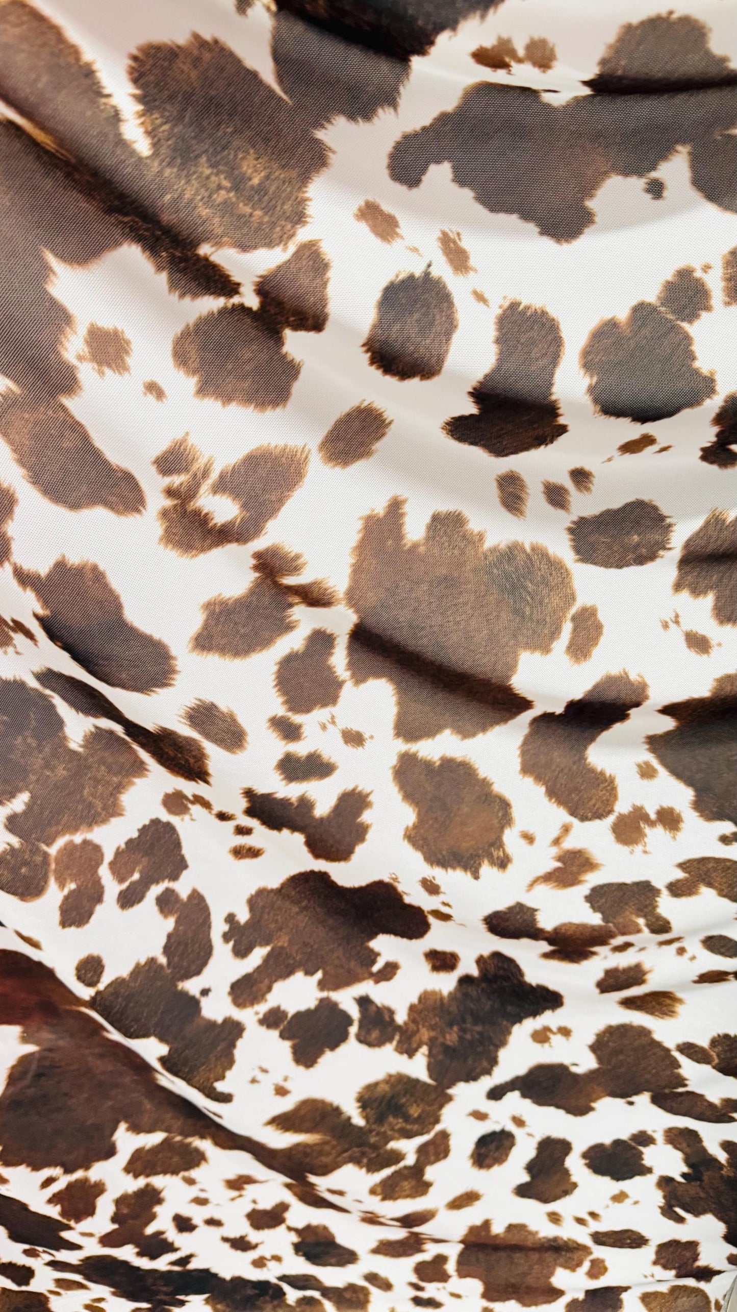 Cow design white/brown print on great quality of nylon mesh 4-way stretch 58/60” Sold by the YD. Ships Worldwide from Los Angeles California