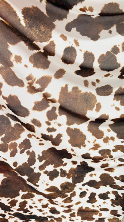 Cow design white/brown print on great quality of nylon mesh 4-way stretch 58/60” Sold by the YD. Ships Worldwide from Los Angeles California