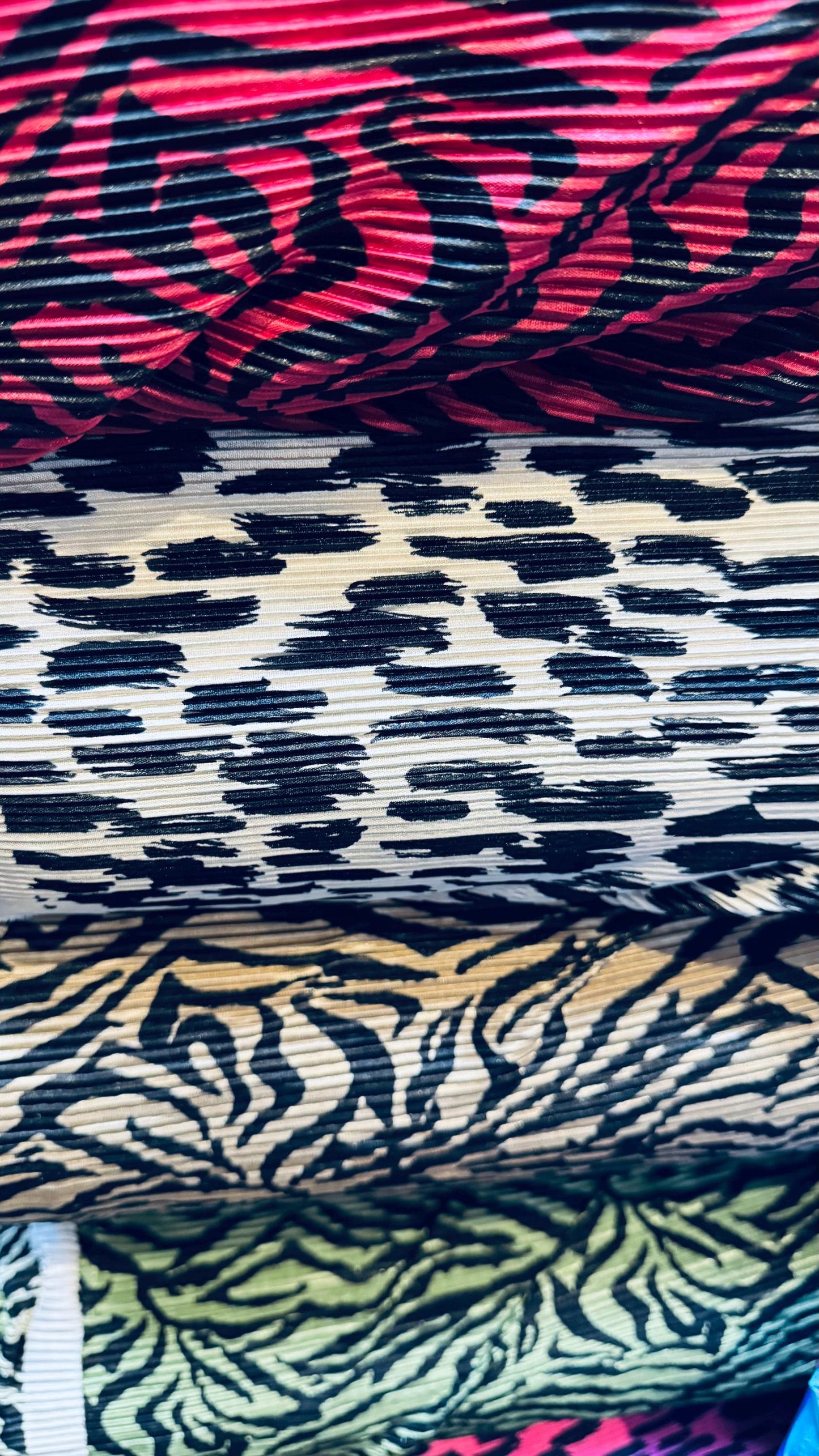 Exotic animal print leopard and zebra design print on pleated poly spandex fabric 58/60” Sold by the YD. Ships Worldwide from Los Angeles CA