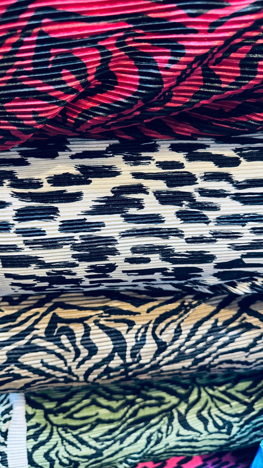 Exotic animal print leopard and zebra design print on pleated poly spandex fabric 58/60” Sold by the YD. Ships Worldwide from Los Angeles CA