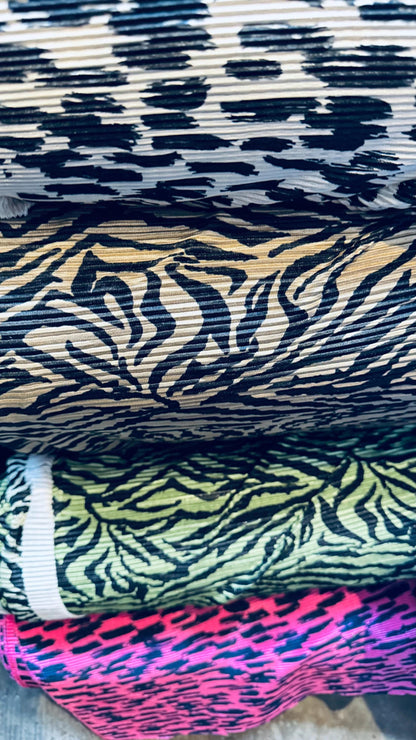 Exotic animal print leopard and zebra design print on pleated poly spandex fabric 58/60” Sold by the YD. Ships Worldwide from Los Angeles CA