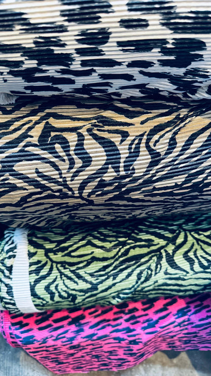 Exotic animal print leopard and zebra design print on pleated poly spandex fabric 58/60” Sold by the YD. Ships Worldwide from Los Angeles CA