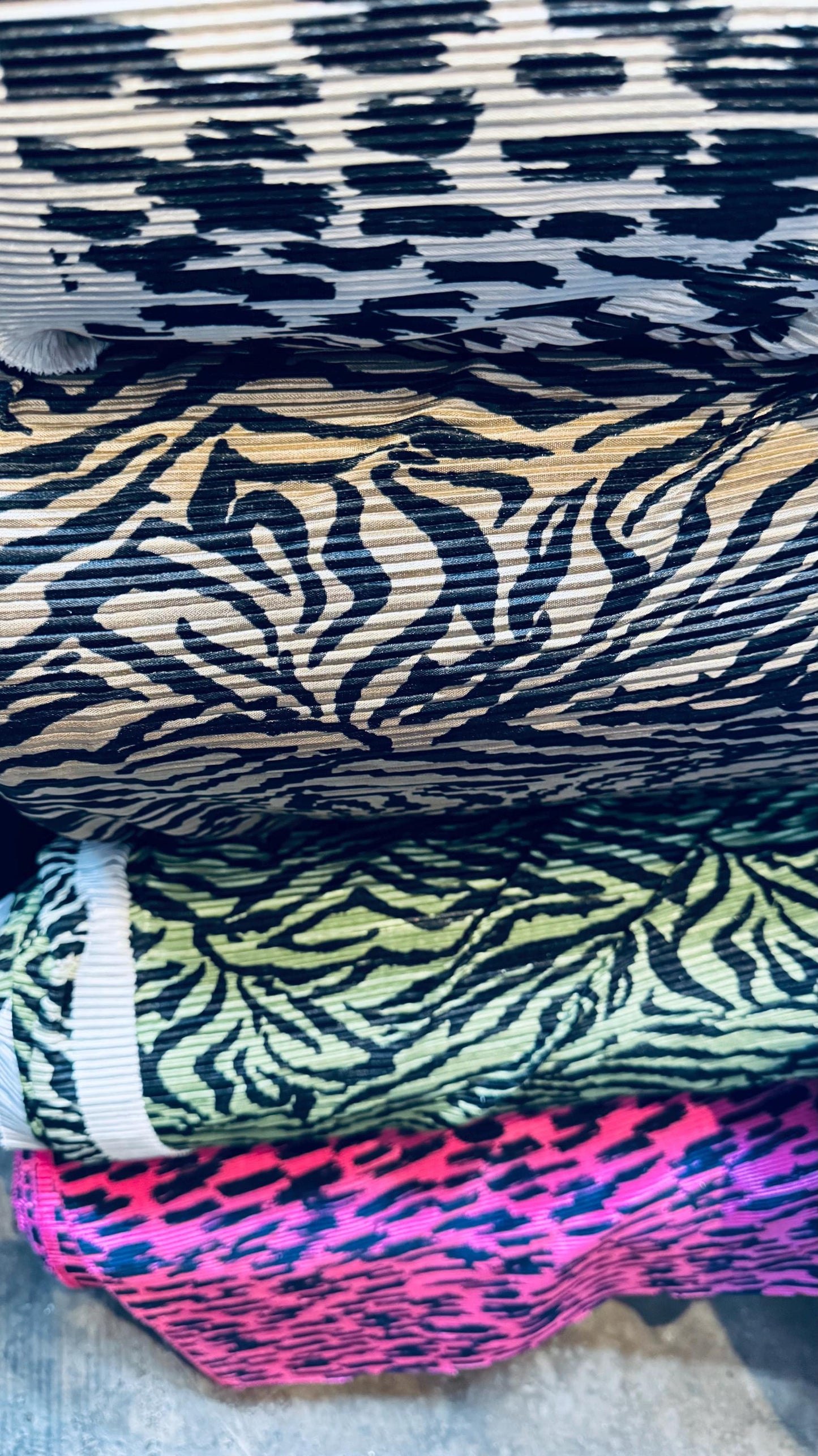 Exotic animal print leopard and zebra design print on pleated poly spandex fabric 58/60” Sold by the YD. Ships Worldwide from Los Angeles CA